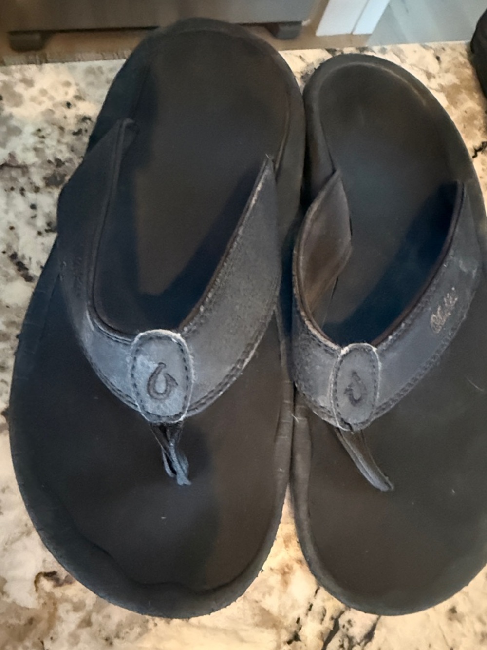 OluKai Men’s Black Flip-Flop Sandals